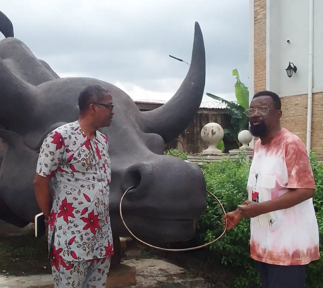 A photo featuring the owner and a staff of Bona Art Gallery and Museum Enugu